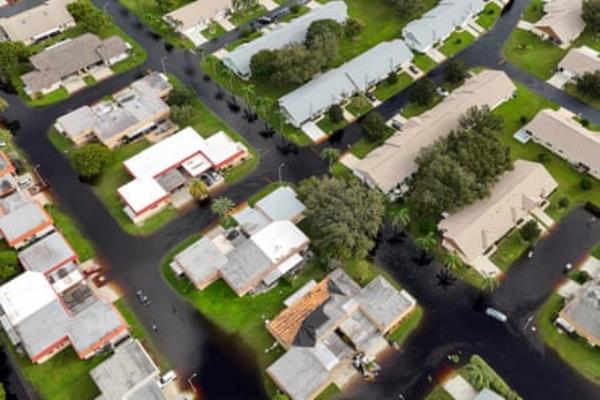 an aerial of flooded streets in a neighborhood