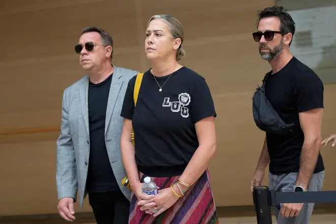 The sons of Gisele Pelicot, Florian, right, David, left, and her daughter Caroline Darian, center, arrive in the Avignon court house