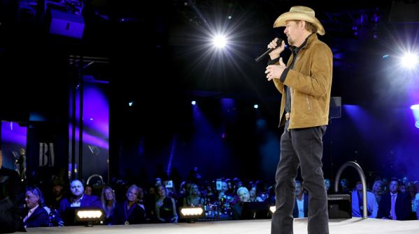 Toby Keith hat singing on stage