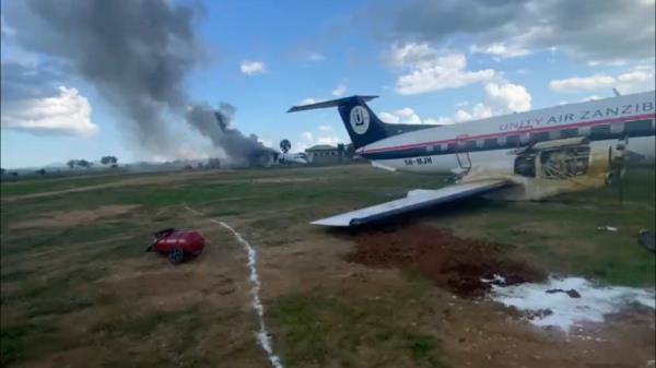 Two planes damaged, one smoking in background