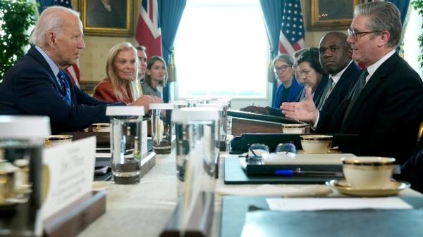 President Joe Biden, left, hosts a bilateral meeting with UK Prime Minister Keir Starmer, right, in the Blue Room of the White House, Friday, Sept. 13, 2024, in Washington. (AP Photo/Manuel Balce Ceneta)