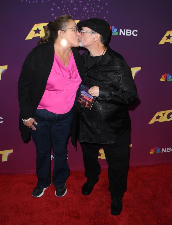 Richard Goodall kisses his wife Angie Vanoven on the red carpet